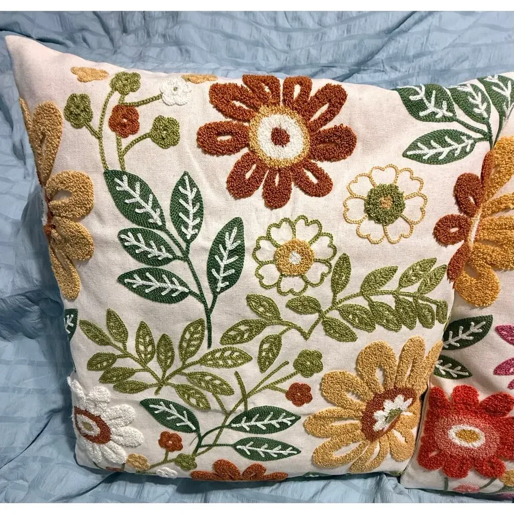 Two new decorative throw pillows Textured punch-needle style floral embroidery